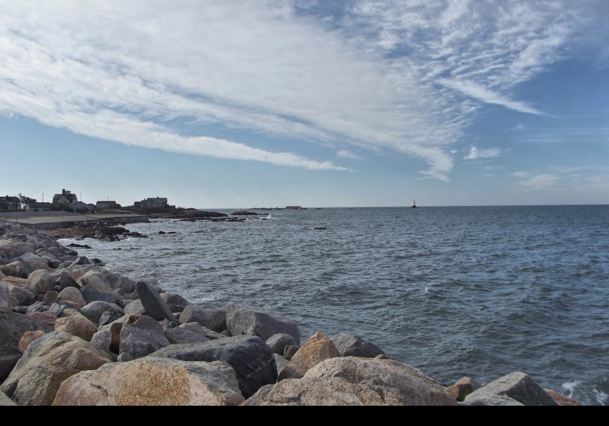 Looking south from the car park towards the lighthouse.  The houses on the left are along Rohde Island Road, and have magnificent views across the Sakonnet River towards Newport; and the lighthouse, of course!