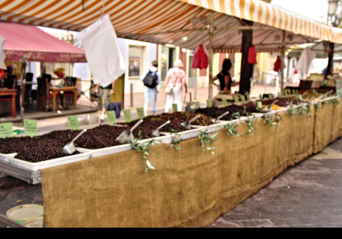 A street market in Marseilles that we visited when we got back from Cassis.  This is an olive stand.  Sorry it is a little blurred; made a mistake on the camera.  