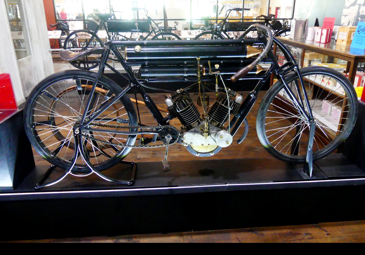Hercules Model 24.  2 Cylinder, 5hp, sir-cooled, Belt driven.  This is a duplicate of the cycle that Glenn Curtiss used to set a speed record covering one mile in 59 seconds & 8:54 for 10 miles at Ormond Beach, FL in January 1904.