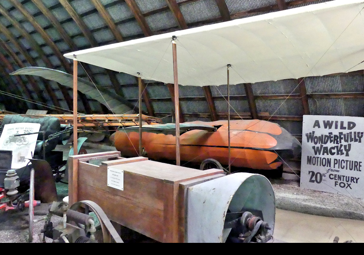 The "Passett Ornithopter" from 1912.  Intended to fly by flapping its wings like a bird.  This one, the orange contraption in the background, was built for 20th Century Fox, and used in "Those Magnificent Men in their Flying Machines"  