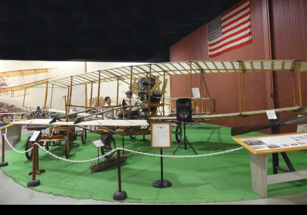 The "June Bug", 1908. Designed by Curtiss, it was the 1st aircraft to fly 1 km. On July 4, 1908, Curtiss piloted it on the flight that won the Scientific American Trophy, and it is considered the first pre-announced, public flight in America. The museum's reproduction was built by volunteers from the Mercury Aircraft Corp. in Hammondsport, & was flown successfully in 1976.  