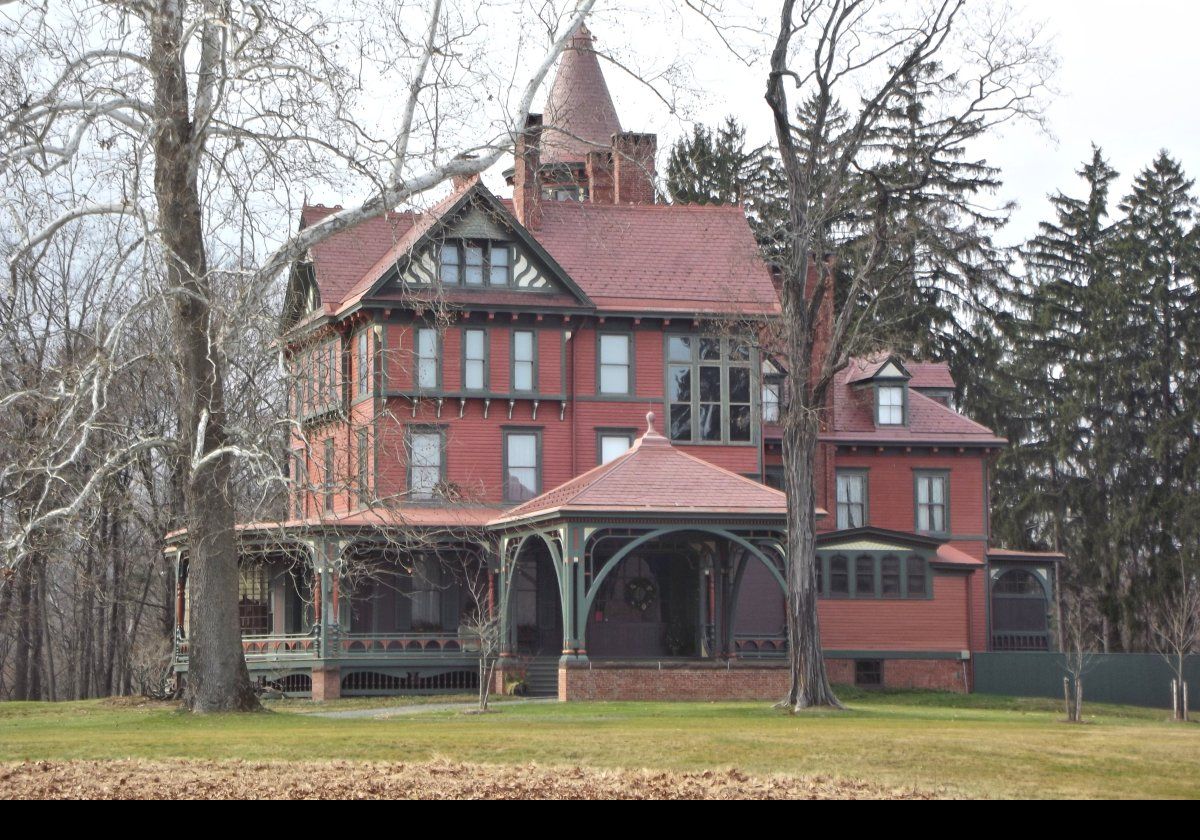 Thomas’ son Robert Bowne Suckley & his wife, Elizabeth hired Arnout Cannon to enlarge the house in 1888.  He added an additional floor making the house three stories with a five story circular tower.  He also added an elaborate porte-cochere & verandah giving us the Queen Anne style house we see today.