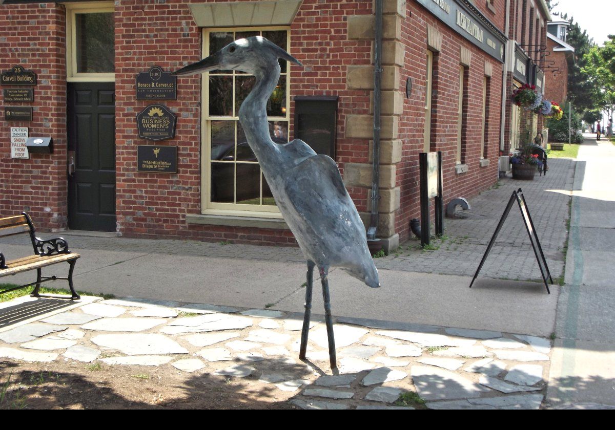A statue of a blue heron by Prince Edward Island artist Ahmon Katz.  It is on the southwest corner of Queen Street and Water Street, outside the Merchantman seafood bar.
