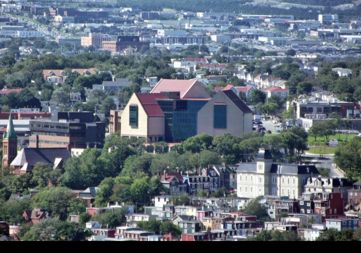The building at the center is The Rooms. This cultural facility is home to the Art Gallery of Newfoundland & Labrador, the Provincial Archives of Newfoundland & Labrador and the Provincial Museum of Newfoundland & Labrador. The Rooms has its own page hre.