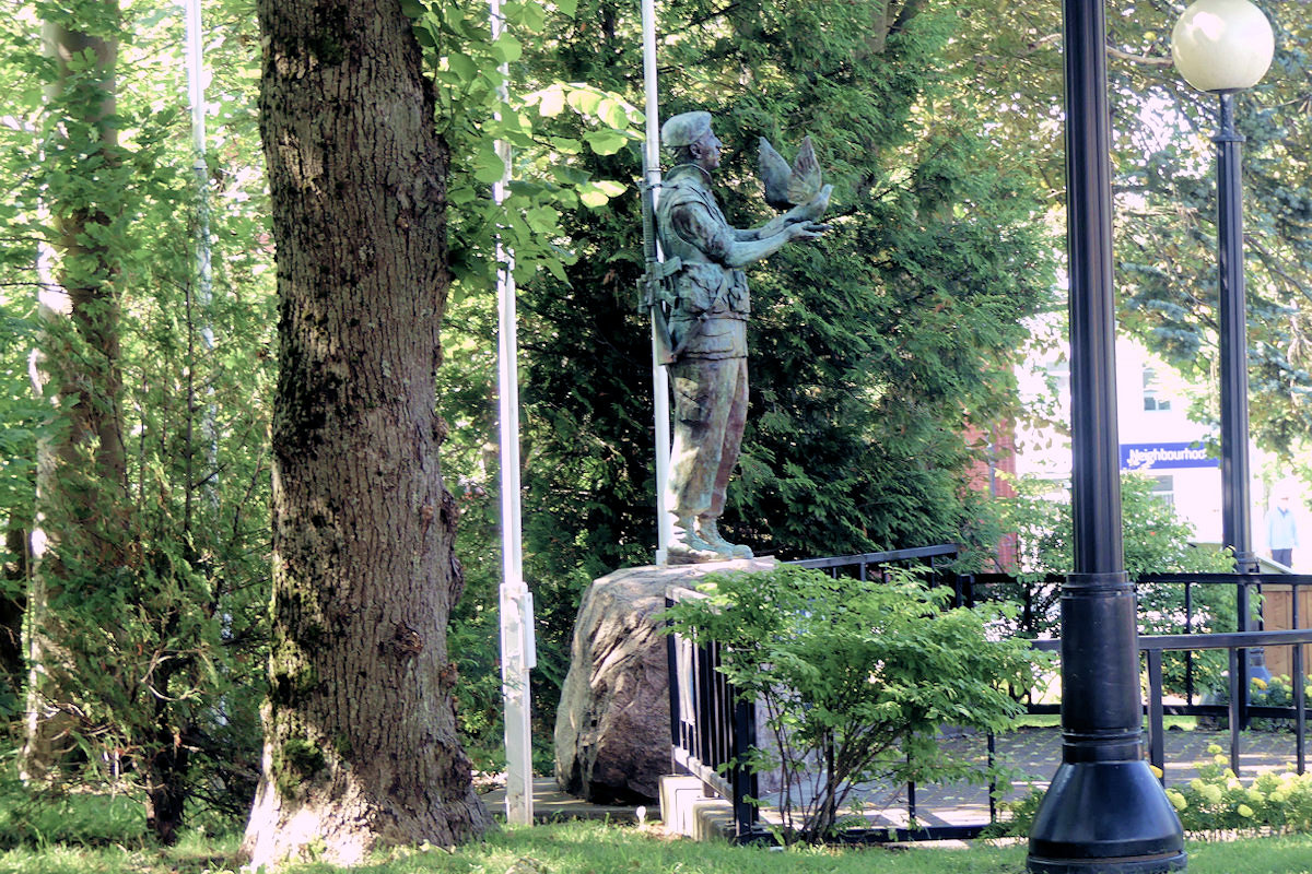 The statue is the Canadian Peace Keeping Memorial located in the Blue Beret Memorial Park, in Veteran's Square.