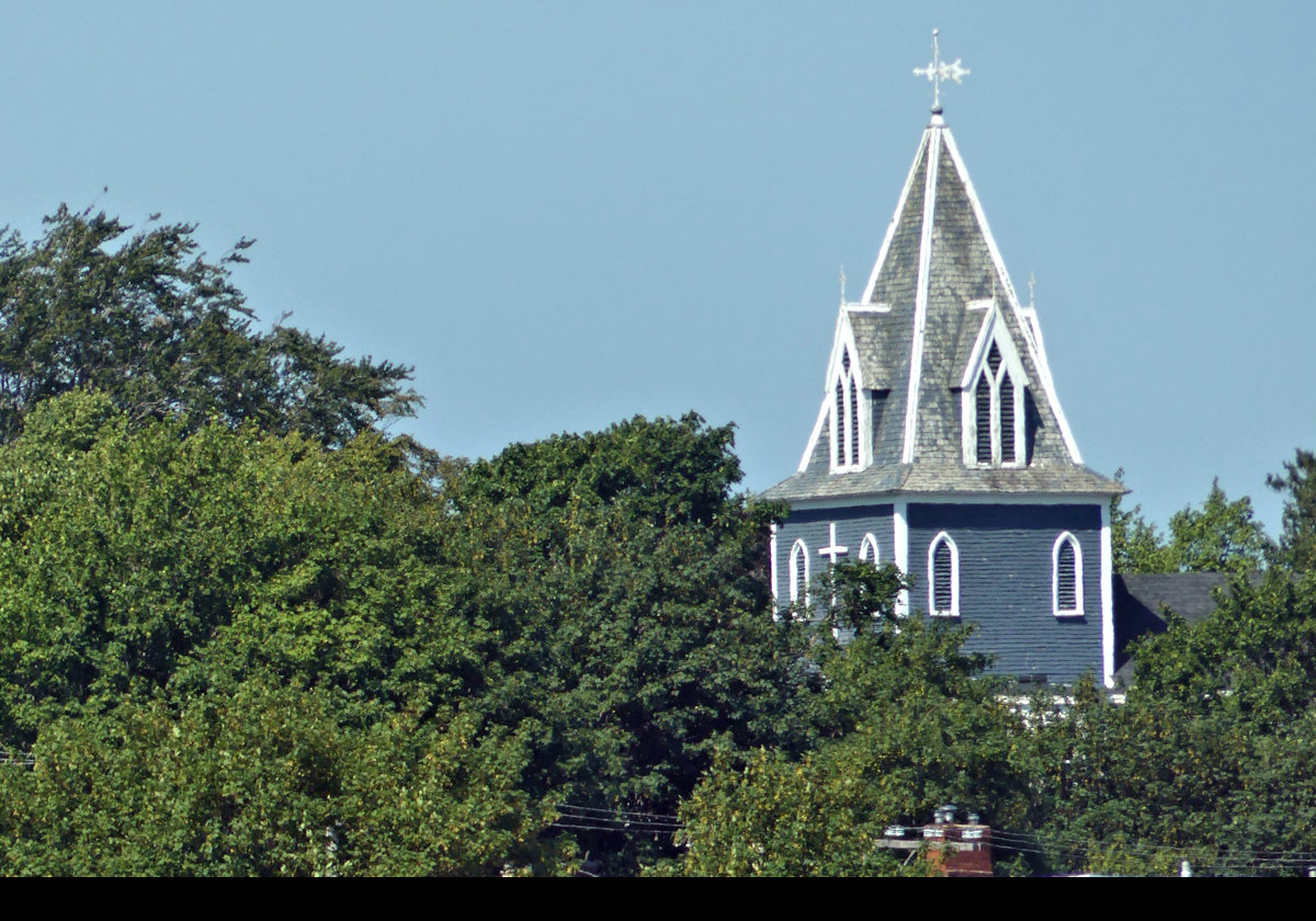 The steeple of St. Thomasâ€™ Anglican Church.  It is a timber-framed church that was built in the Gothic Revival style in 1836.  It is the oldest church in the city of St. Johnâ€™s.