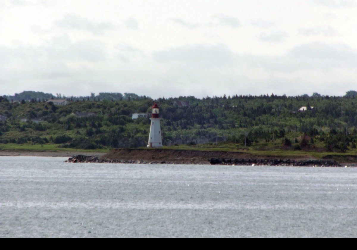The Low Point Lighthouse at the eastern entrance to Sydney Harbour near New Victoria, Nova Scotia.