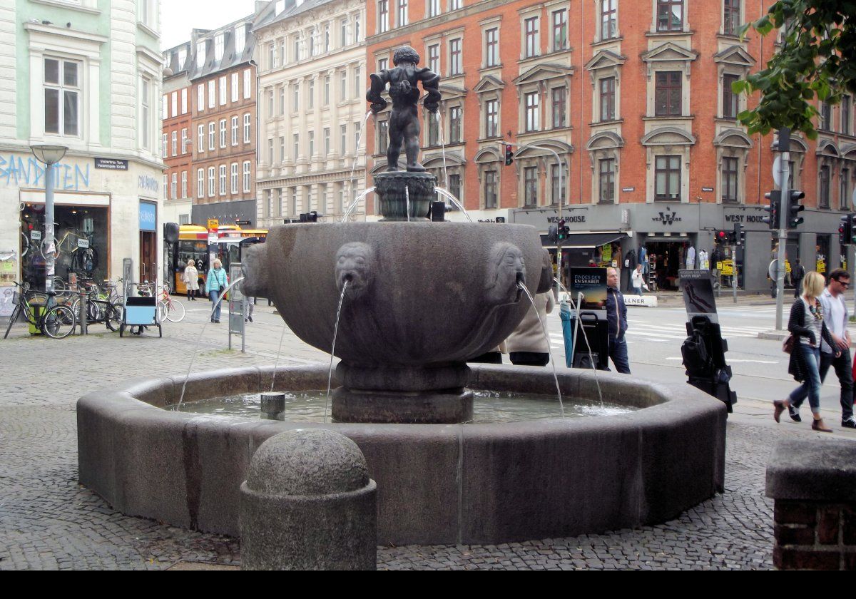 The Hercules Fountain built in 1915 and designed by the sculptor Rasmus Harboe.  He also designed the reliefs on Eliah's Church on the other side of the square.  