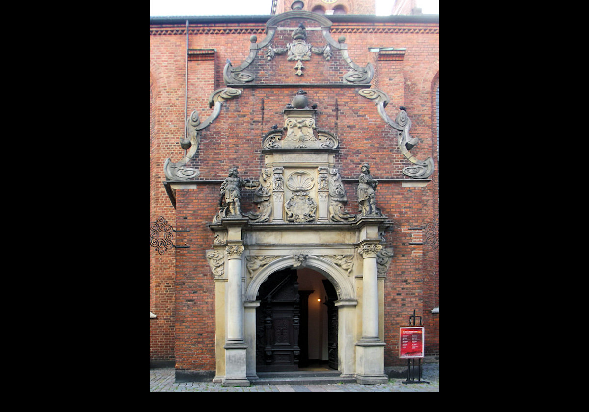 The entrance to the Church of the Holy Spirit,  Helligåndskirken in Danish.  It is one of the oldest churches in the city.  The original church dated back to the 13th century.  The Copenhagen fire in 1728 destroyed the church, and the current church dates to 1732.