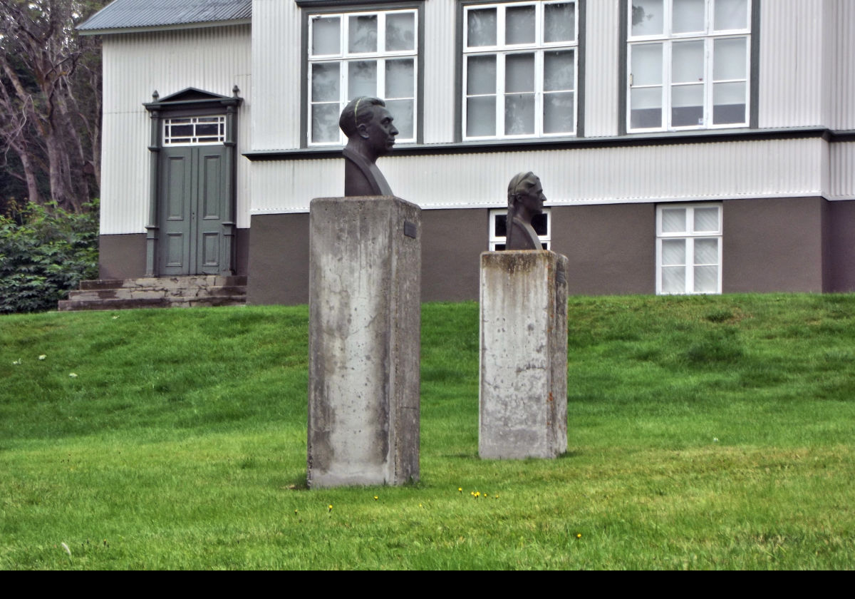 Two heads located outside of the Akureyri Junior College.  I have been unable to identify who they are.