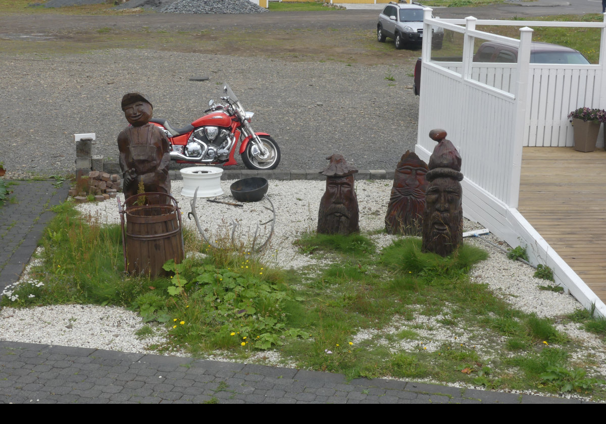 Whimsical carvings outside a house in Seydisfjordur.