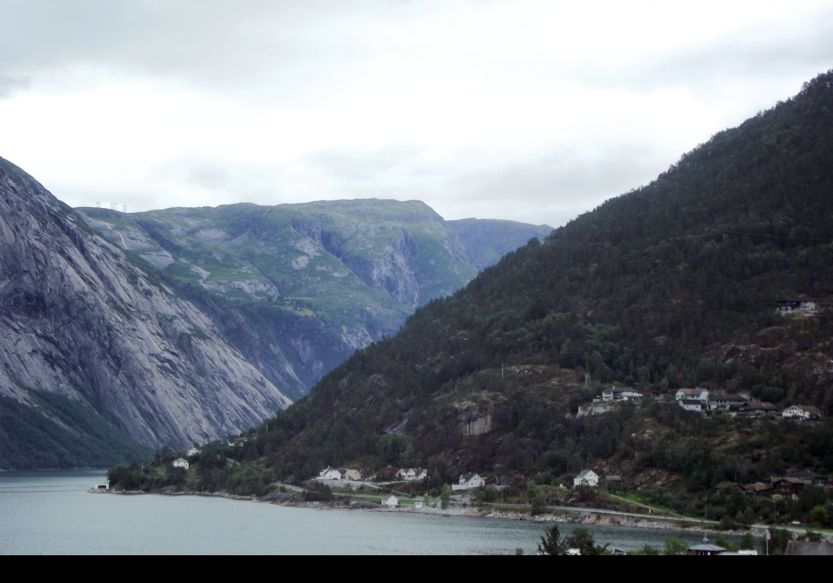 The town has mountains on two sides, the Hardangerfjord to the north-west and Eidfjordvatnet, or Lake Eidfjord, to the south-east.  At 179 kilometres long, or about 112 miles, the Hardangerfjord is the fourth longest fjord in the world.