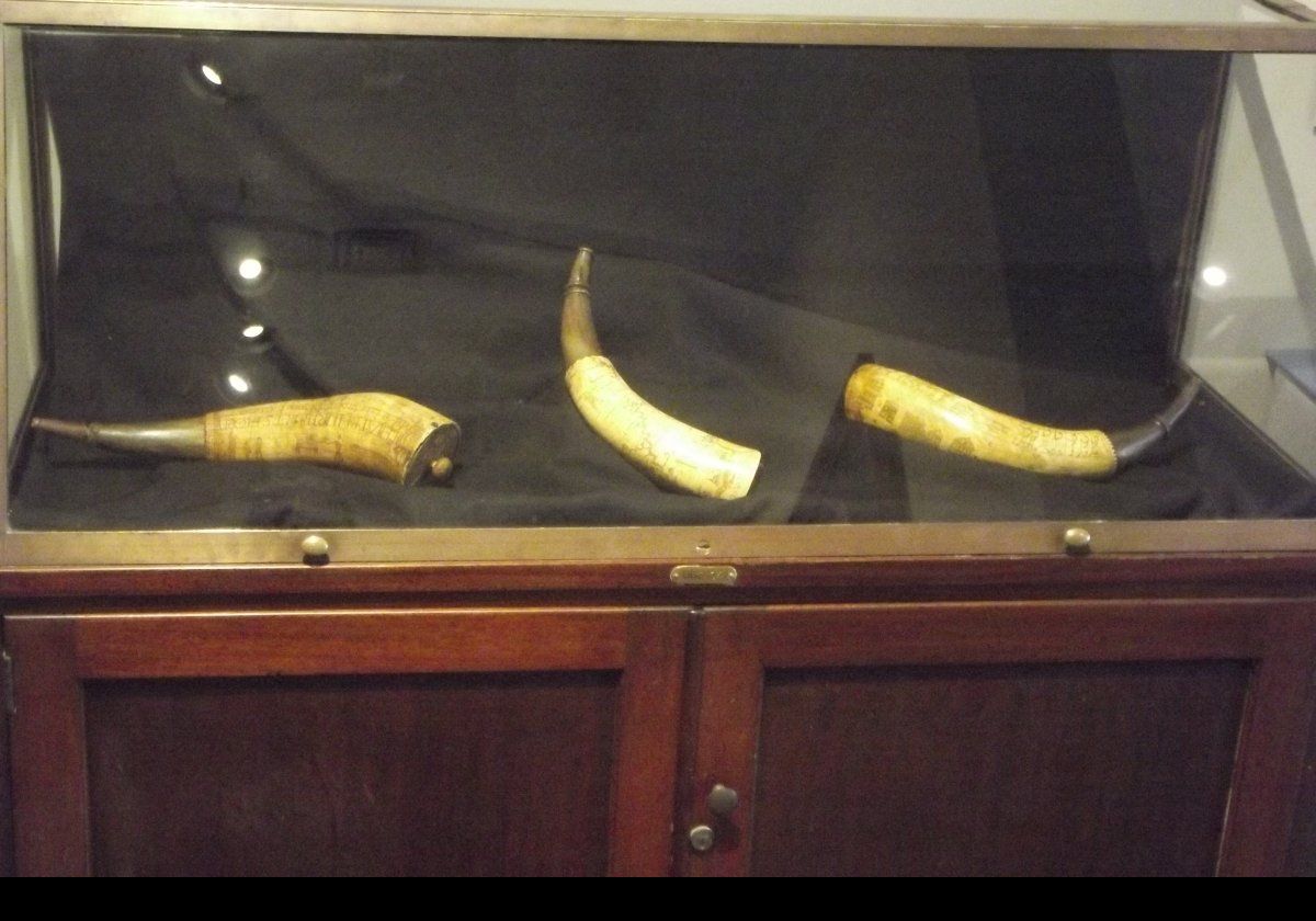 Engraved powder horns.  Some of the engravings show marching troops, and one has a map of the Hudson River.