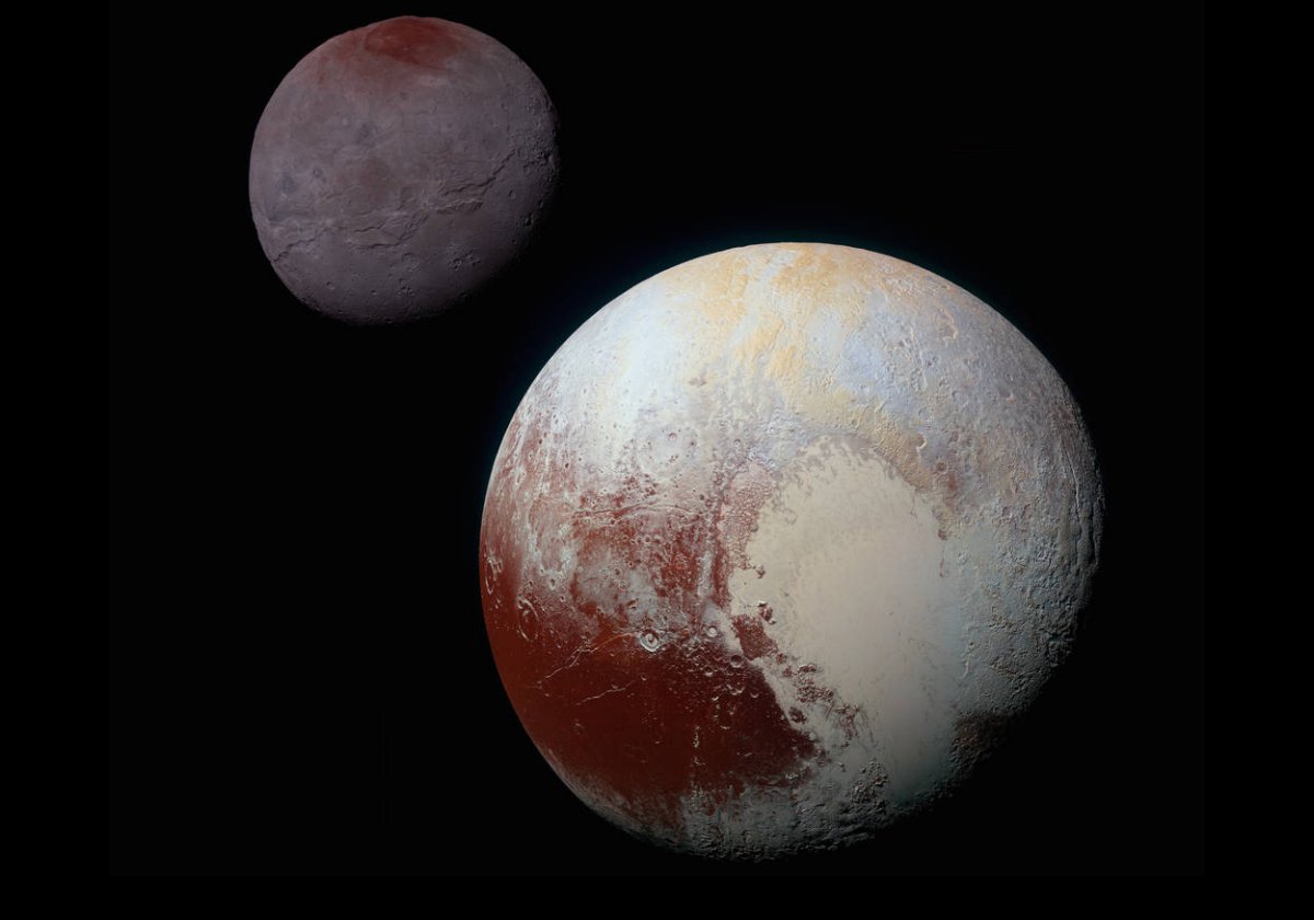 Pluto in the foreground with its largest moon Charon.  The images in this composite picture were taken by NASA’s New Horizons spacecraft as it passed through the Pluto system in 2015. 