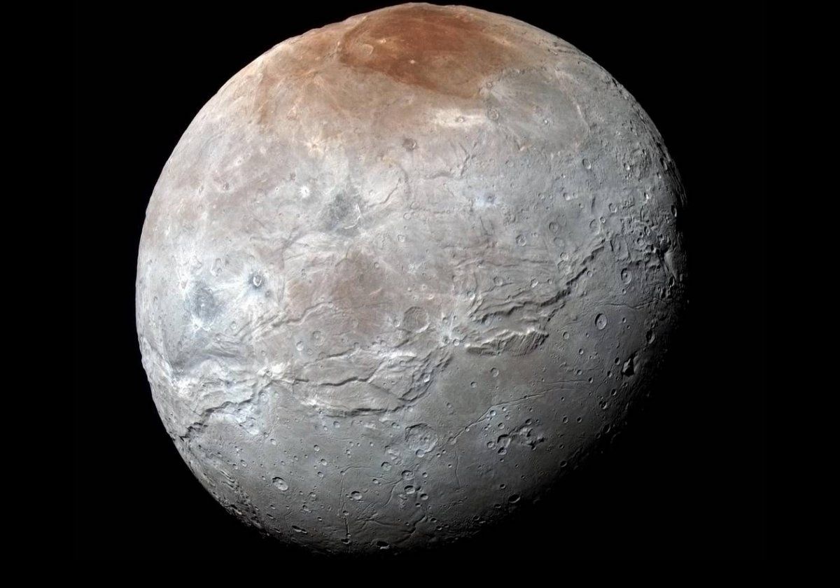 Pluto's largest moon, Charon.  It s just over half the diameter of Pluto, and weighs nearly one eighth of its parent.