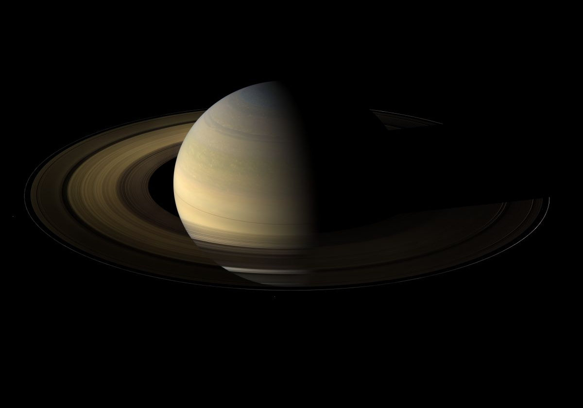 Seen from Earth, the view of Saturn's rings during equinox is extremely foreshortened. From 20 degrees above the ring-plane, Cassini's shot shows Saturn a day & a half after Saturn equinox, when the sun's disk was exactly overhead at the planet's equator.  These scenes are possible only during the few months before and after Saturn's equinox which occurs once in about 15 Earth years.     