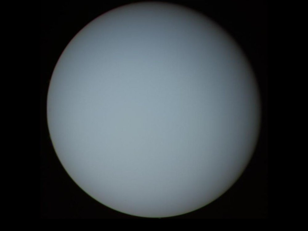 Photograph taken by the Voyager 2 probe.  Virtually all that we know about Uranus came from the Voyager 2's 1986 flyby. The spacecraft discovered 10 new moons and several rings.  Credit: NASA